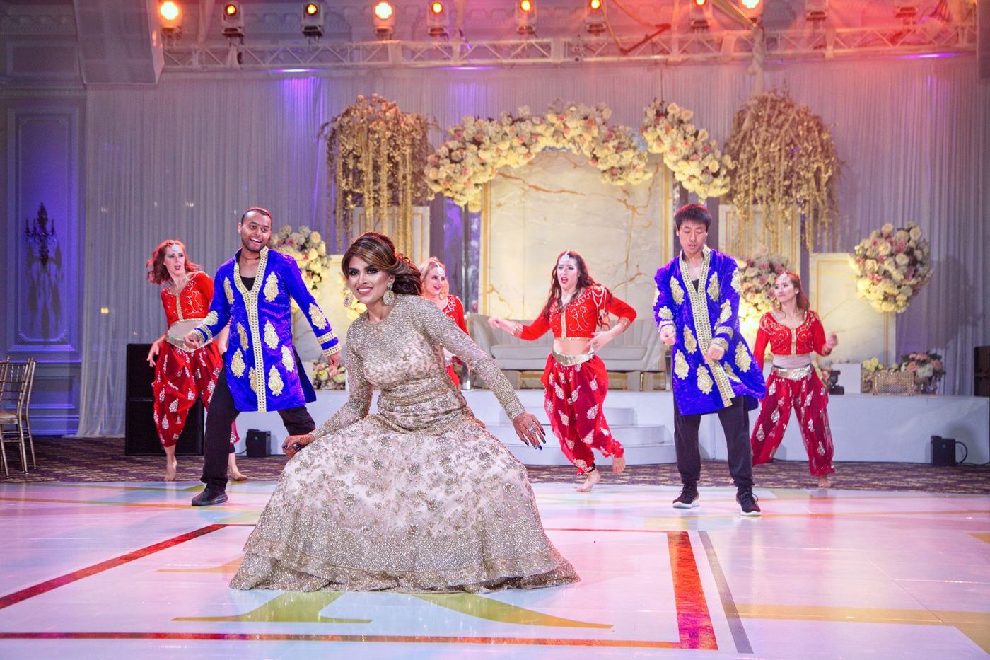 Bridal party performing with the bride on the reception floor
