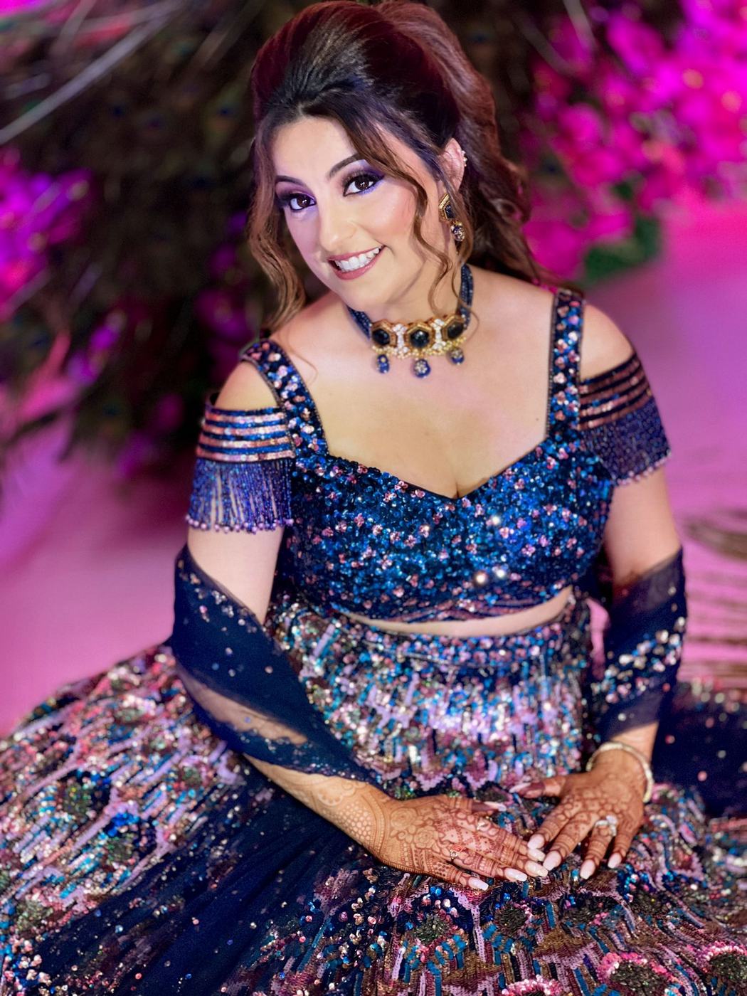 Bride in a navy sequinned lehenga at the reception