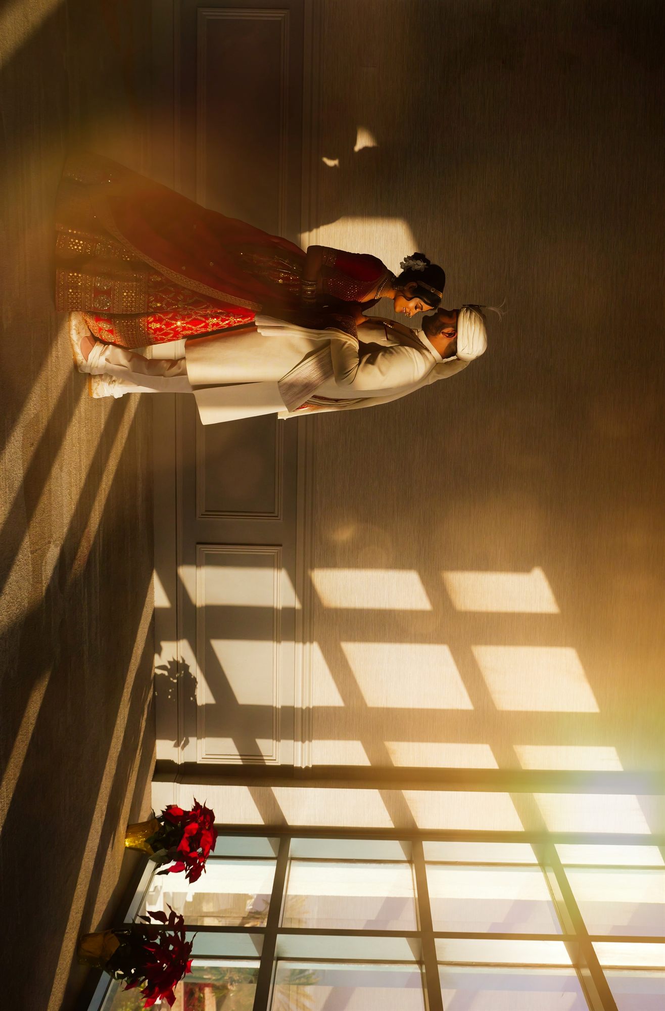 Bride resting in window light across a patterned floor