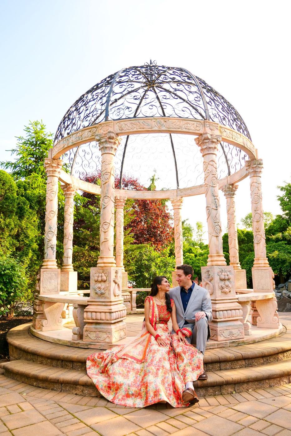 Couple seated at the domed iron gazebo of The Imperia, Somerset