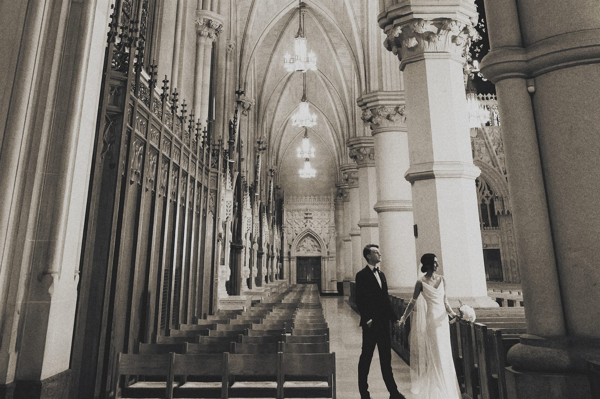 couple cathedral corridor black and white
