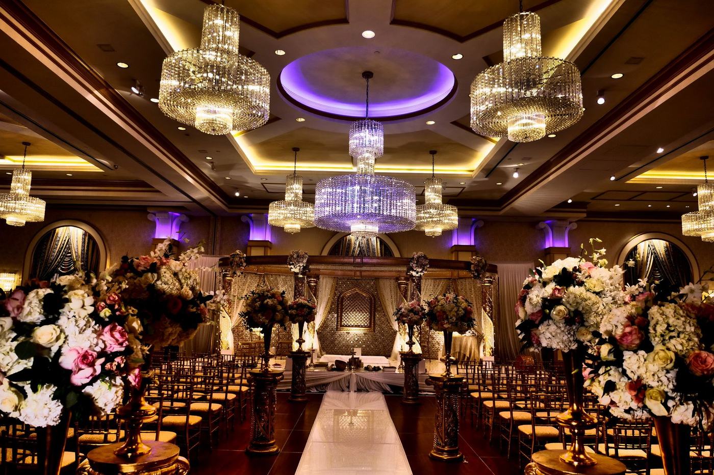 Ballroom aisle beneath crystal chandeliers at The Grove, New Jersey